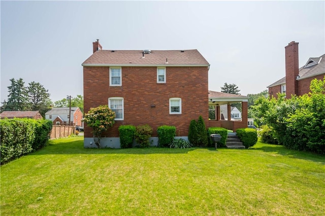 33 S Vireo Dr, Kennedy Twp, PA 15136 - rear view of house featuring a chimney and brick siding