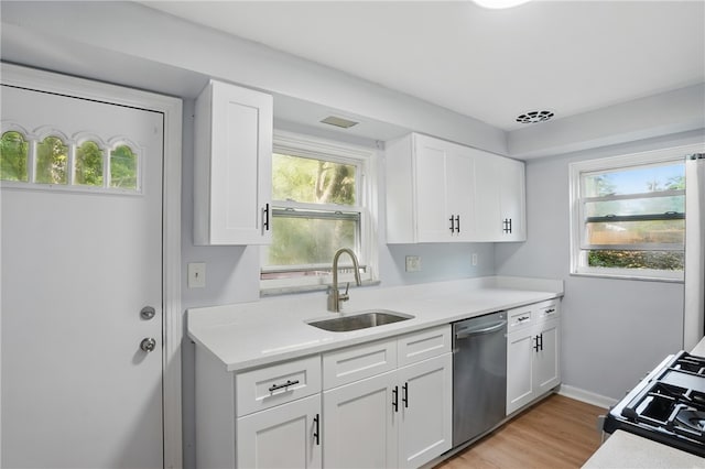 3917 Beechwood Blvd, Squirrel Hill, PA 15217 - kitchen featuring stainless steel dishwasher, light countertops, and white cabinets