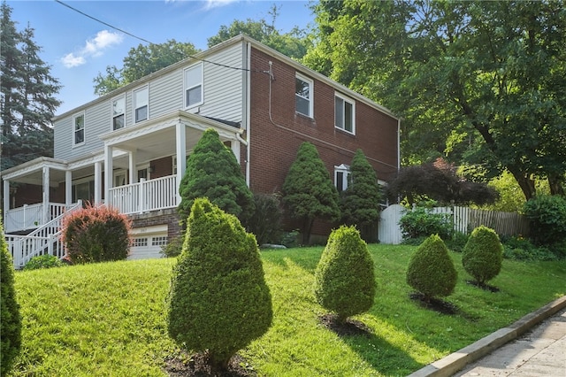 3917 Beechwood Blvd, Squirrel Hill, PA 15217 - view of side of property featuring covered porch, brick siding, stairs, and an attached garage