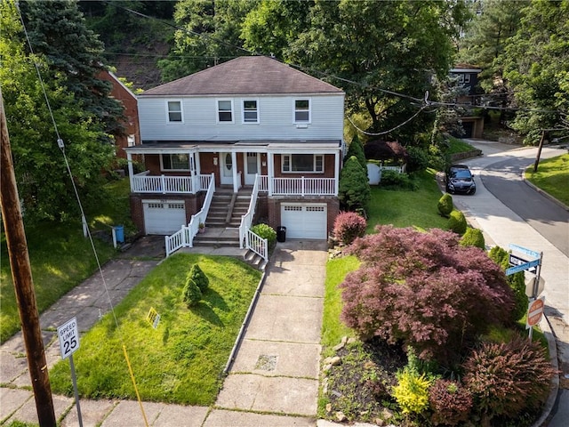 3917 Beechwood Blvd, Squirrel Hill, PA 15217 - view of front of property with an attached garage, covered porch, concrete driveway, and a front lawn