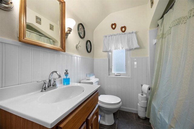 3337 Churchview Ave, Baldwin Boro, PA 15227 - full bathroom featuring vanity, wainscoting, vaulted ceiling, tile patterned floors, and curtained shower