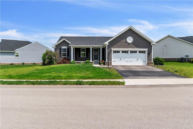 313 Camden Dr, Lehigh Twp, PA 16063 - ranch-style house featuring a garage, asphalt driveway, and a front yard