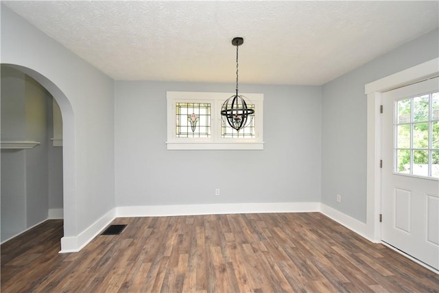2300 Palm Beach Ave, Beechview, PA 15216 - unfurnished dining area with wood finished floors, a chandelier, arched walkways, and a textured ceiling