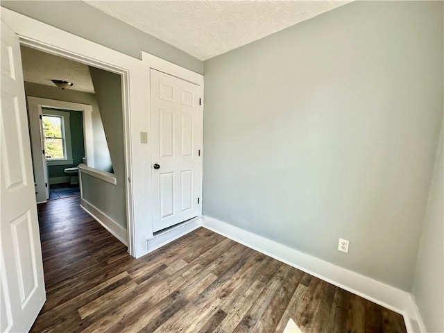 2300 Palm Beach Ave, Beechview, PA 15216 - unfurnished bedroom featuring dark wood-style floors and a textured ceiling