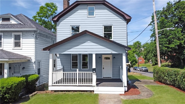 2300 Palm Beach Ave, Beechview, PA 15216 - view of front of house featuring a porch, a chimney, and a front yard