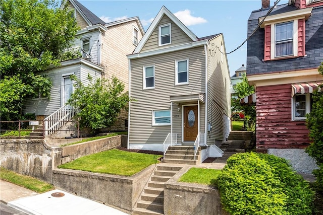 435 Walde St, Mount Oliver, PA 15210 - view of front of home with entry steps, a chimney, and a front yard