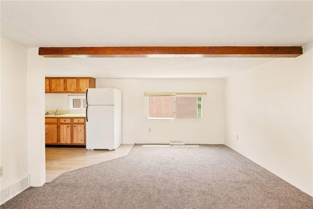 501 Bay, Stonycreek Twp, PA 15902 - unfurnished living room featuring light carpet and beam ceiling