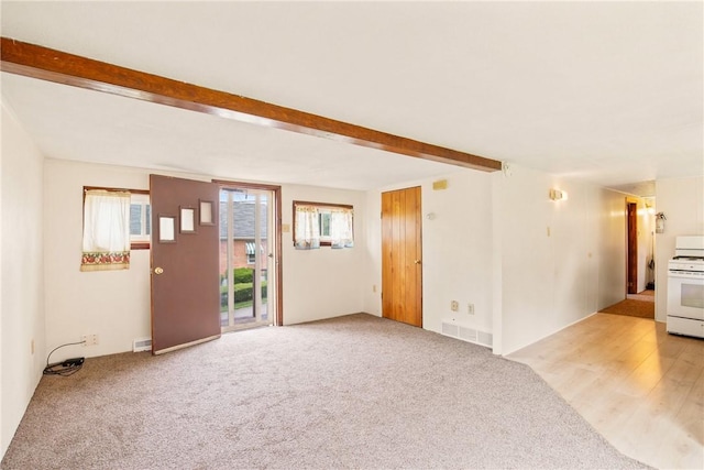 501 Bay, Stonycreek Twp, PA 15902 - unfurnished living room with beamed ceiling and light carpet
