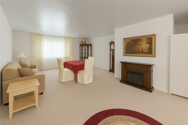 4717 Coleridge St, Stanton Heights, PA 15201 - carpeted dining room with a glass covered fireplace and baseboards