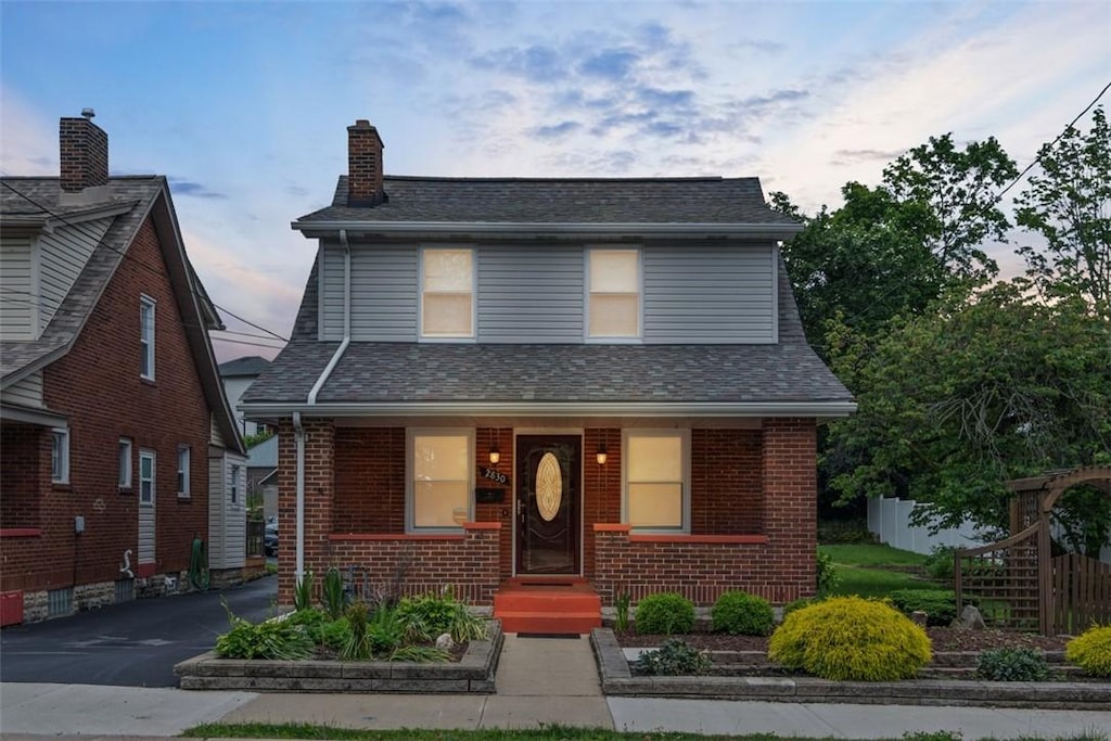 2830 Castlegate Ave, Brookline, PA 15226 - view of front of property with brick siding, a chimney, and covered porch
