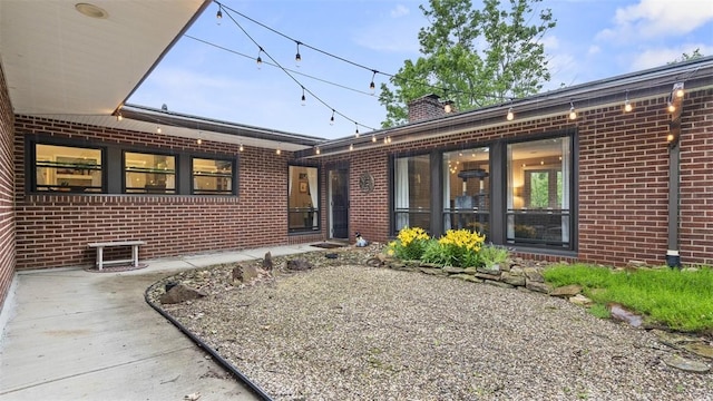 1451 Keystone St, Natrona Hts/Harrison Twp, PA 15065 - rear view of property with brick siding and a chimney