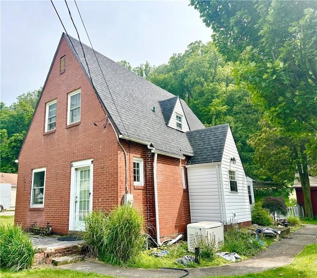 150 Lick Hollow Rd, South Union Twp, PA 15445 - view of property exterior featuring brick siding and roof with shingles
