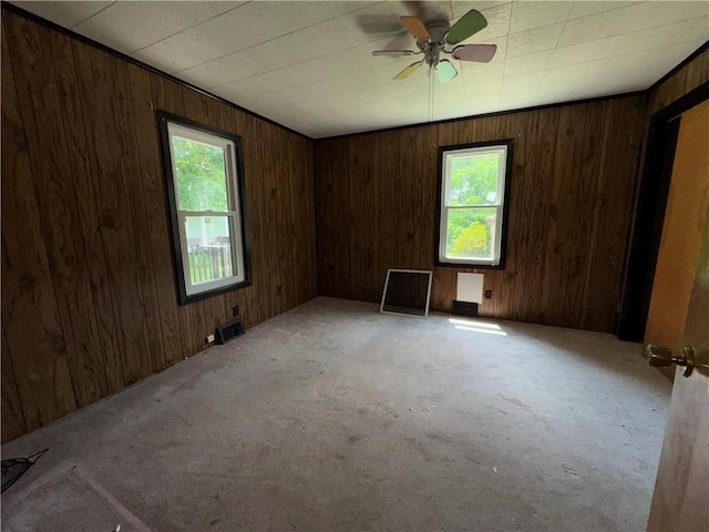 3112 Ridge Ave, Hopewell Twp Bea, PA 15001 - carpeted empty room with plenty of natural light, wood walls, and ceiling fan