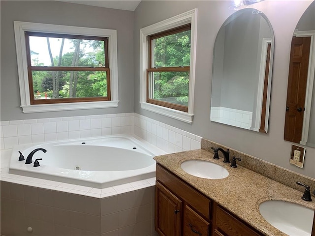 306 Marigold Dr, Unity Twp, PA 15601 - full bathroom featuring double vanity and a tub with jets