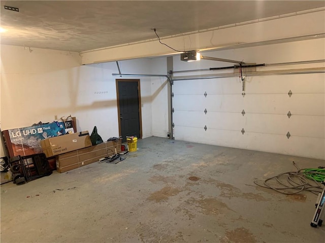 306 Marigold Dr, Unity Twp, PA 15601 - garage featuring a garage door opener