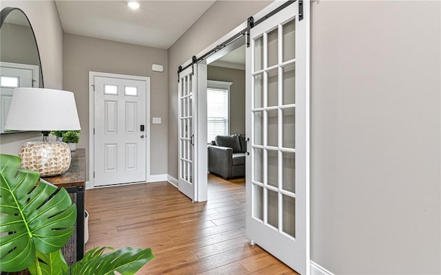 1191 Brook View Ct, Mccandless, PA 15237 - entrance foyer featuring a barn door, french doors, and wood-type flooring