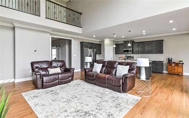 1191 Brook View Ct, Mccandless, PA 15237 - living room with recessed lighting, light wood-style floors, ornamental molding, and a high ceiling