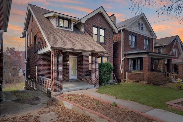 3485 Beechwood Blvd, Greenfield, PA 15217 - view of front of property featuring brick siding, a front yard, roof with shingles, a chimney, and covered porch