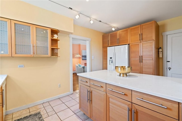3485 Beechwood Blvd, Greenfield, PA 15217 - kitchen featuring white fridge with ice dispenser, track lighting, and light countertops