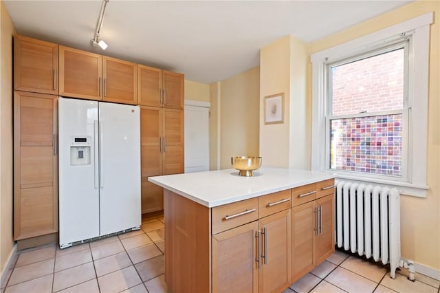 3485 Beechwood Blvd, Greenfield, PA 15217 - kitchen with white refrigerator with ice dispenser, radiator heating unit, light tile patterned floors, light countertops, and a peninsula