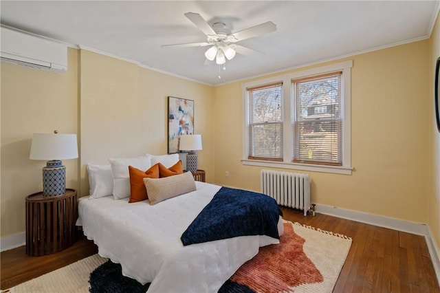 3485 Beechwood Blvd, Greenfield, PA 15217 - bedroom with radiator, a wall mounted air conditioner, wood finished floors, ornamental molding, and ceiling fan