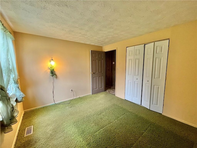 1974 Tara Dr, North Huntingdon, PA 15642 - unfurnished bedroom featuring carpet, a textured ceiling, and a closet
