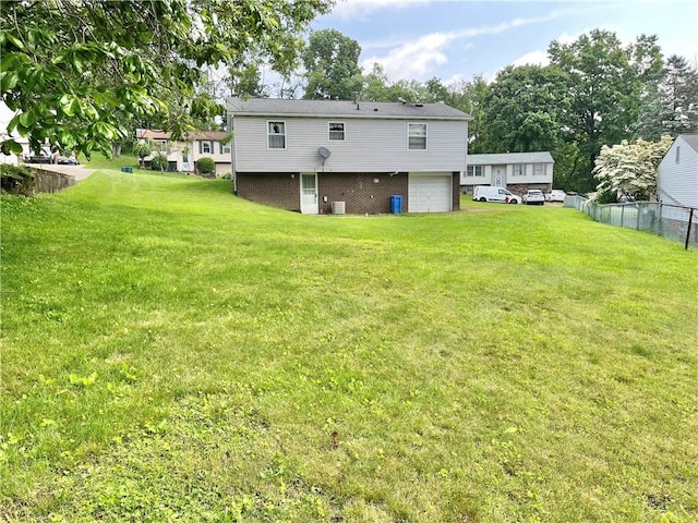 1974 Tara Dr, North Huntingdon, PA 15642 - rear view of house with a garage