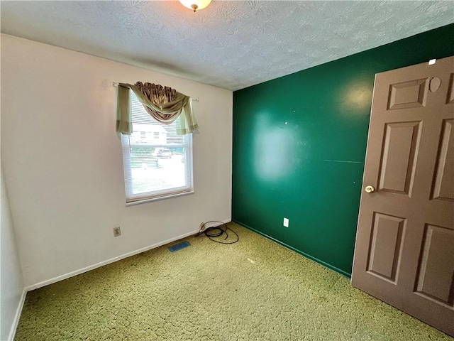 1974 Tara Dr, North Huntingdon, PA 15642 - carpeted spare room with a textured ceiling and baseboards