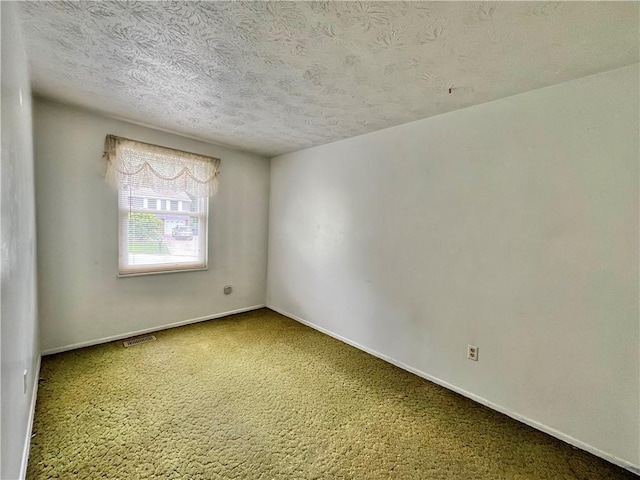 1974 Tara Dr, North Huntingdon, PA 15642 - carpeted empty room with a textured ceiling and baseboards