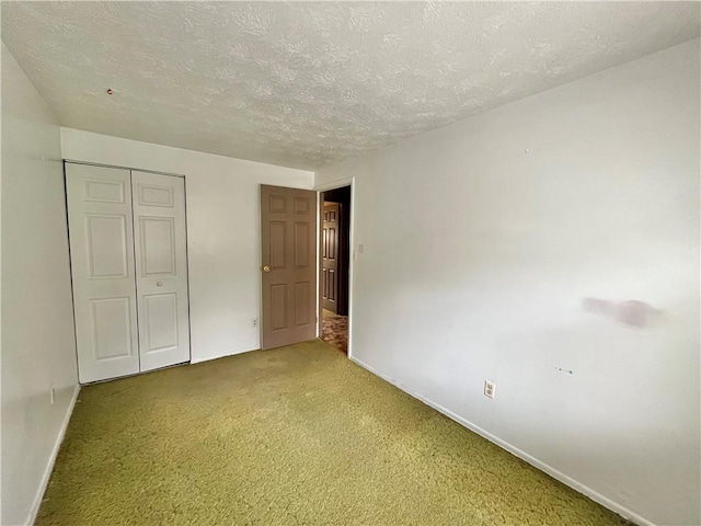 1974 Tara Dr, North Huntingdon, PA 15642 - unfurnished bedroom featuring a textured ceiling, light colored carpet, and a closet