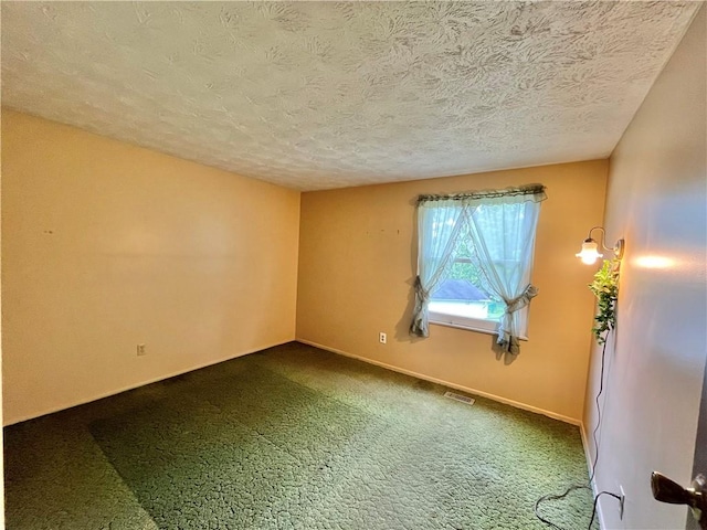 1974 Tara Dr, North Huntingdon, PA 15642 - empty room featuring a textured ceiling and dark carpet