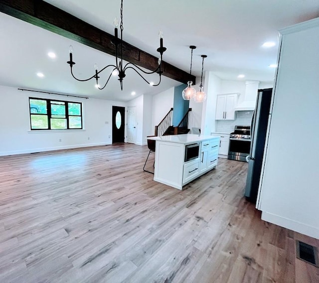 155 Broadbent Rd, Ohio Twp, PA 15143 - kitchen with stainless steel appliances, open floor plan, beamed ceiling, a chandelier, and a breakfast bar