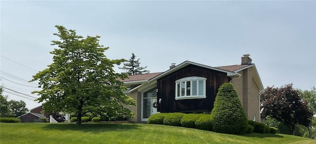143 Herbst Rd, Kennedy Twp, PA 15108 - view of side of property with a yard and a chimney