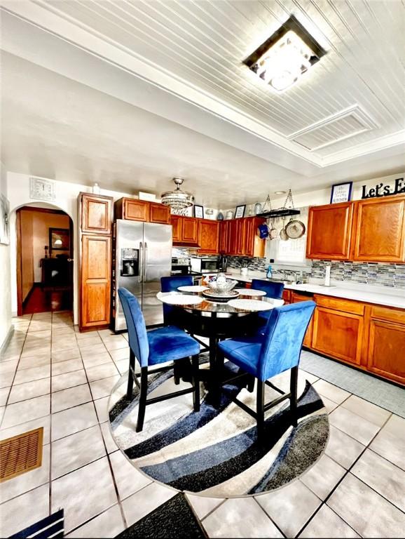 201 Esther Ave, New Kensington, PA 15068 - dining area featuring light tile patterned floors and arched walkways