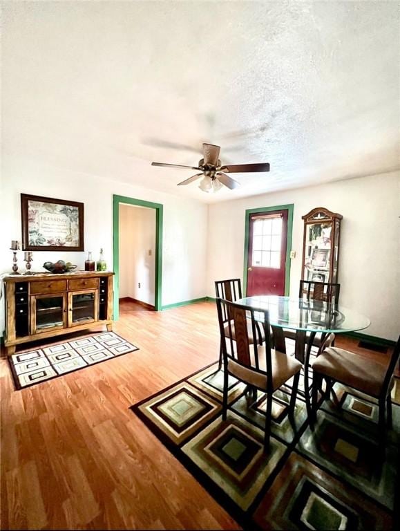 201 Esther Ave, New Kensington, PA 15068 - dining area with wood finished floors, a ceiling fan, and a textured ceiling