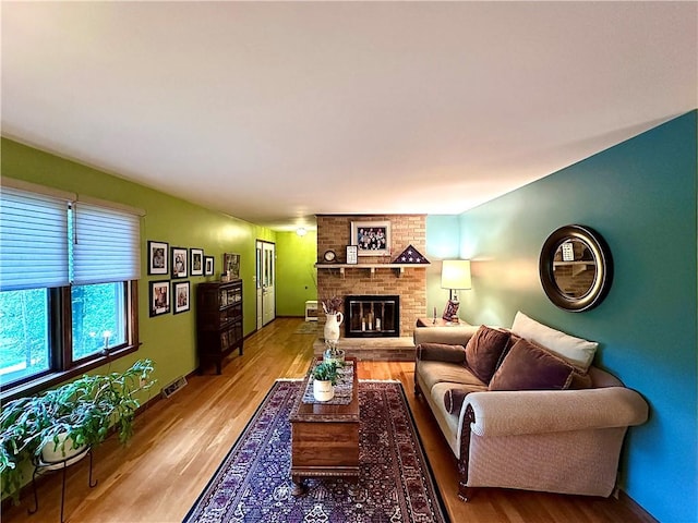 315 Lake Dr, Neshannock Twp, PA 16105 - living room with light wood-type flooring and a brick fireplace