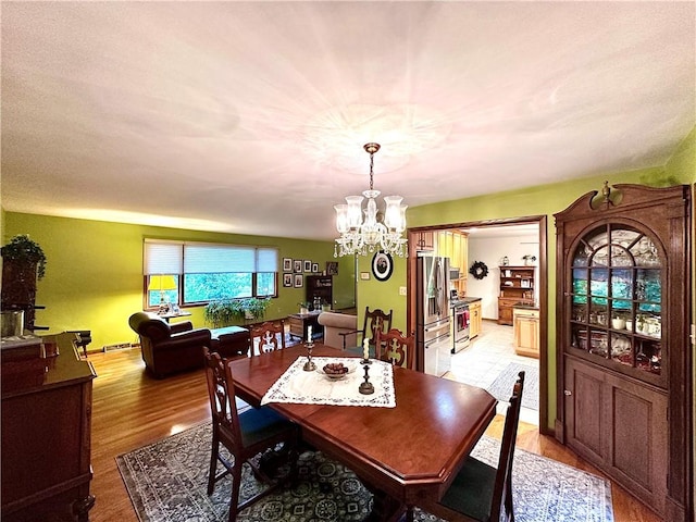 315 Lake Dr, Neshannock Twp, PA 16105 - dining room with a chandelier and light wood-type flooring