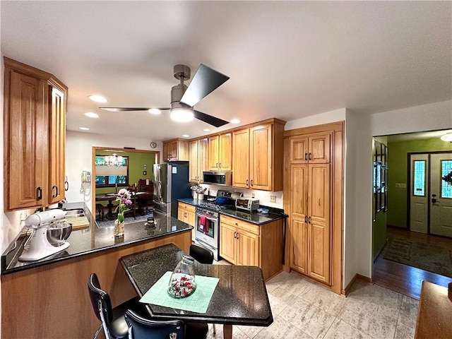 315 Lake Dr, Neshannock Twp, PA 16105 - kitchen featuring stainless steel appliances, a ceiling fan, recessed lighting, brown cabinets, and a peninsula