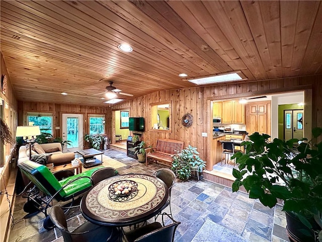 315 Lake Dr, Neshannock Twp, PA 16105 - living area with wooden walls, wood ceiling, recessed lighting, a ceiling fan, and stone finish floors