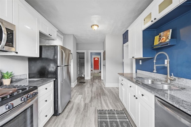 12 Township Rd, West View, PA 15229 - kitchen featuring stainless steel appliances, white cabinetry, glass insert cabinets, light wood-style floors, and stone countertops