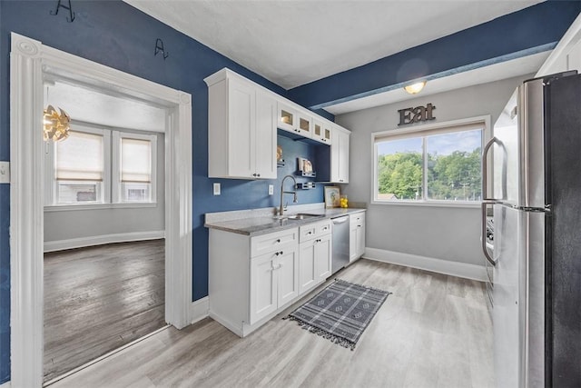 12 Township Rd, West View, PA 15229 - kitchen featuring appliances with stainless steel finishes, light wood finished floors, white cabinetry, and glass insert cabinets