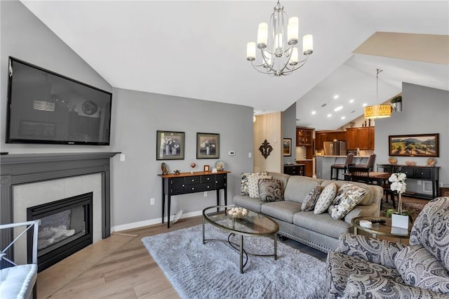 1041 Clerkenwell Ln, Cranberry Twp, PA 16066 - living room with lofted ceiling, light wood-style floors, a chandelier, a tile fireplace, and recessed lighting
