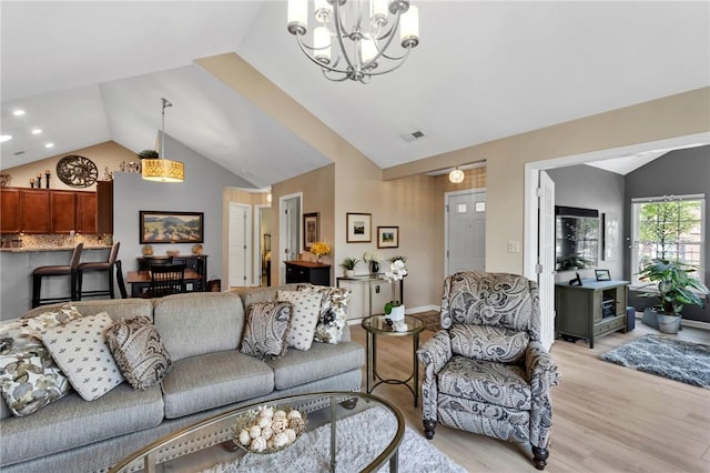 1041 Clerkenwell Ln, Cranberry Twp, PA 16066 - living room featuring vaulted ceiling, a chandelier, light wood-style flooring, and recessed lighting
