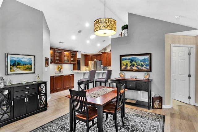 1041 Clerkenwell Ln, Cranberry Twp, PA 16066 - dining space with light wood-style floors and high vaulted ceiling