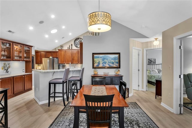 1041 Clerkenwell Ln, Cranberry Twp, PA 16066 - dining area with light wood finished floors, high vaulted ceiling, and recessed lighting