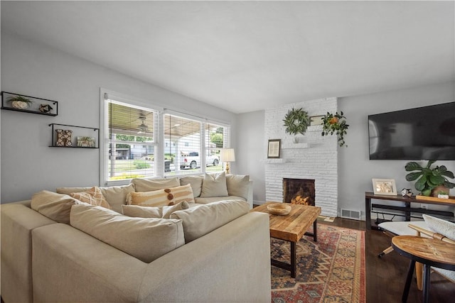 108 Mary St, Ross Twp, PA 15214 - living area with dark wood-style flooring and a brick fireplace