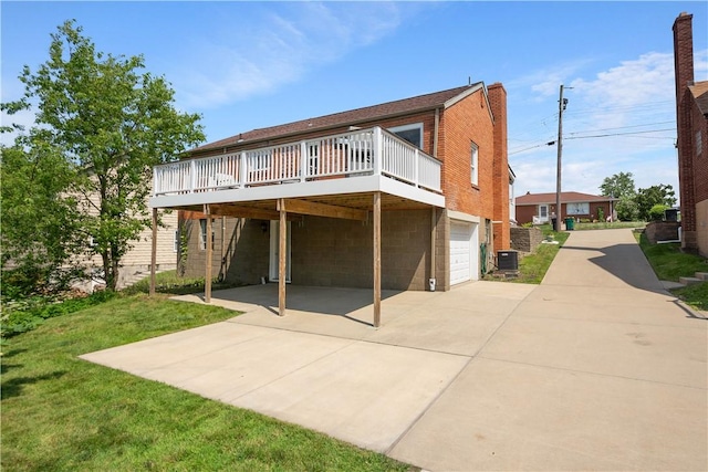 108 Mary St, Ross Twp, PA 15214 - back of property featuring concrete driveway, a garage, a deck, a carport, and a chimney