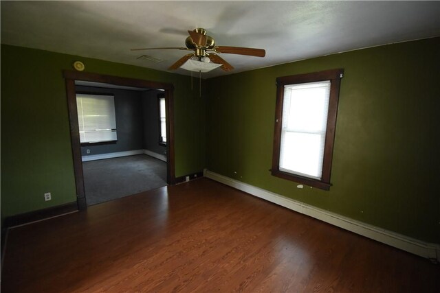1354 Water St, Indiana Boro Ind, PA 15701 - empty room featuring a baseboard radiator, a ceiling fan, and dark wood-type flooring