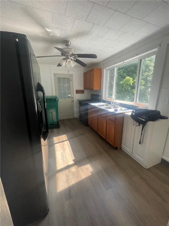 1354 Water St, Indiana Boro Ind, PA 15701 - kitchen featuring fridge with ice dispenser, light wood-type flooring, washer / clothes dryer, and brown cabinetry