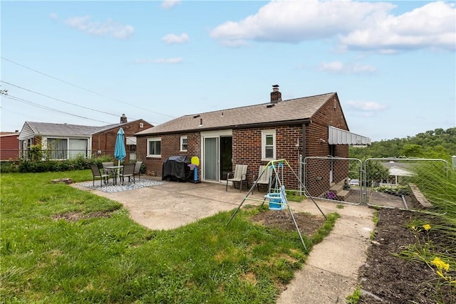 237 Creston, West Mifflin, PA 15122 - back of house featuring brick siding, a patio, and a chimney